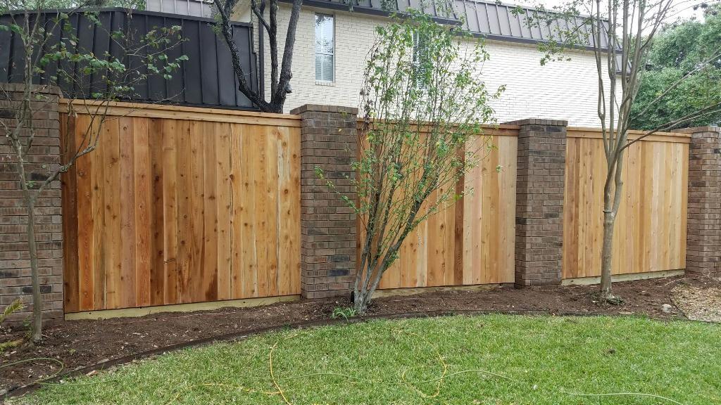 Beautiful modern wood fence in Texas backyard by Postmasters Fencing